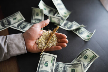 The concept of the cost of grain. 100 dollar banknotes around a handful of ground grain. World...