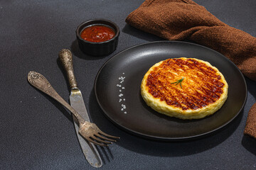 Grilled Halloumi cheese served on plate. Cutlery, traditional food for picnic or BBQ