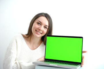 Fototapeta premium Woman freelancer is working on a new project on computer. White Display. High quality 4k footage