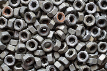 Texture made of old metal nuts. Lots of iron nuts.