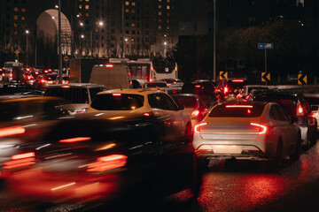 Evening car traffic in a big city. Cars in motion and standing in traffic jams. Long exposure...