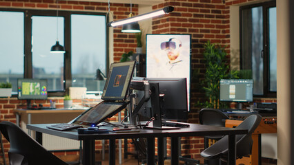 High tech programming office with workstations to plan 3d development for modern production, running professional softwares. Programming technical prototype or developing game.