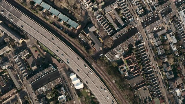 Top down aerial view over London Westway expressway cutting through residential neighbourhoods