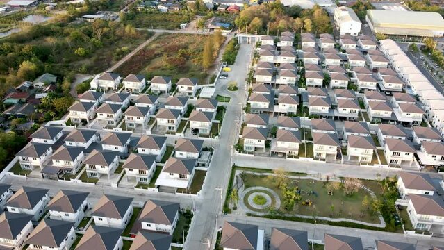 Aerial view of new real estate construction house development project. Residential area community with cityscape. Village pattern urban for family.