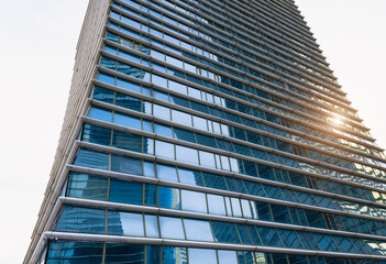 Sunset reflected off modern glass facades of skyscrapers in the financial center of the city