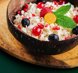 coconut bowl with cottage cheese and ripe berries