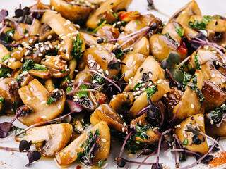 Warm salad with fried mushrooms closeup