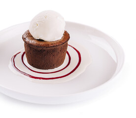 Chocolate fondant and a scoop of ice cream in a white plate