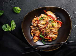 Asian udon noodles with chicken vegetables and teriyaki sauce