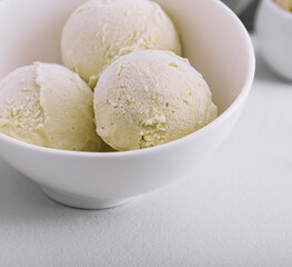 Fototapeta na wymiar Bowl of delicious pistachio ice cream