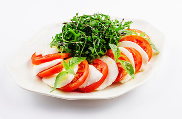 Traditional italian caprice salad tomato mozzarella cheese and basil