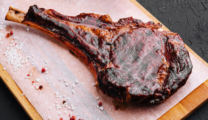 Grilled pork steak on wooden board