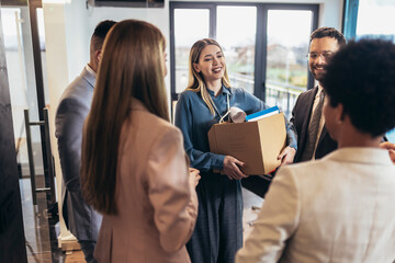 Young woman having first working day getting acquainted with colleagues