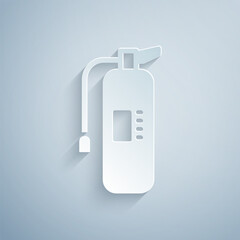 Paper cut Fire extinguisher icon isolated on grey background. Paper art style. Vector