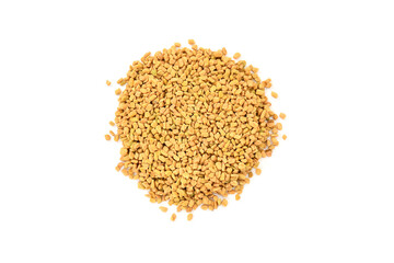Top view of Fenugreek seeds (methi dana, hulba, heyseed, dari) on white background. raw fenugreek seeds isolated on white, top view. Pile of Fenugreek seeds isolated on white background.