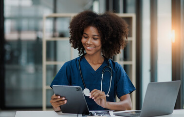 female doctor standing with digital tablet working inside modern clinic office, 