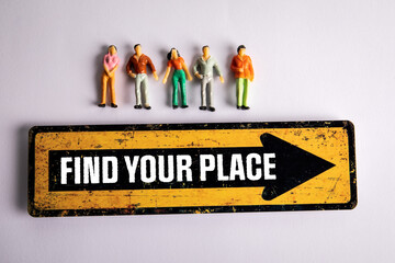 Find Your Place. Yellow directional sign and miniature people on a white background