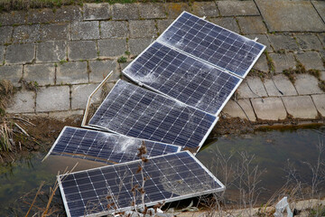 solar panels destroyed by the storm. detail. capricious weather. disaster.
