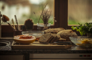 Still life of homemade bread and fruits in domestic kitchen