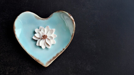 Coconut milk flavor, Sam Pan Nee traditional Thai handcraft snack on pastel blue heart shape plate, Dark background, Royal famous Thai sweets dessert