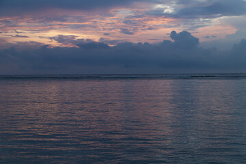 Fototapeta premium Lombok and Gili Air islands, overcast, cloudy day, sky and sea. Sunset, sand beach.