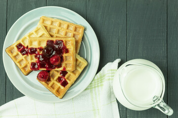 Fresh Belgian waffles with fruits, top view. Tasty breakfast