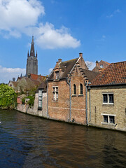 Fototapeta premium Bruges, April 2023: Magnificent facades of the buildings of Bruges, the Venice of the North