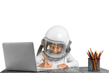 child studies remotely at school, wearing an astronaut's helmet. back to school