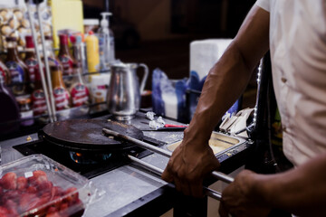 hand preparing Marquesitas mexican dessert traditional in Yucatan and Cancun Mexico in Latin America, Marquesita