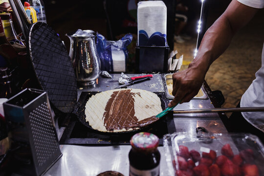 hand preparing Marquesitas mexican dessert traditional in Yucatan and Cancun Mexico in Latin America, Marquesita