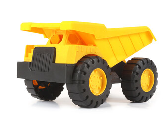 Plastic toy tipper truck for children isolated on white background. Vehicle toys concept