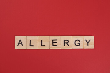 Word Allergy from wooden letters on red background