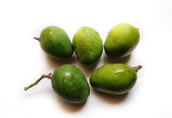 Raw mango in isolated background.
