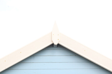 Old English beach hut in pale blue and white with copy space