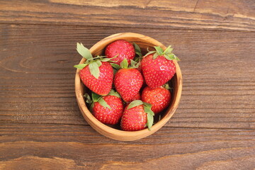 strawberries in a wooden bowl 