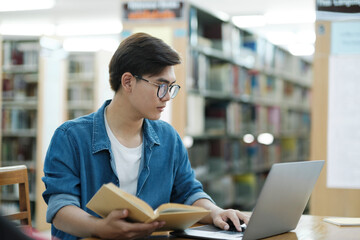 Student studying at library.
