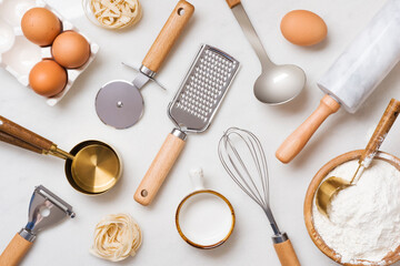 Fototapeta na wymiar Baking preparation concept with variety utensils and ingredients top view