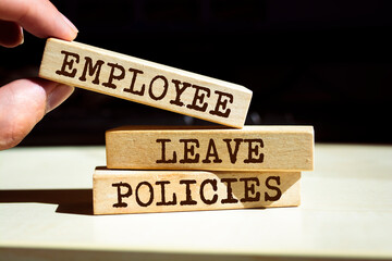 Wooden blocks with words 'Employee Leave Policies'.