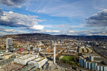 Aerial view of City of Zürich with industrial district on a blue cloudy late winter day. Photo taken March 15th, 2023, Zurich, Switzerland.