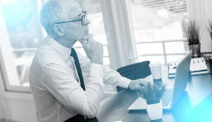 Fototapeta premium Portrait of thoughtful senior businessman; light effect