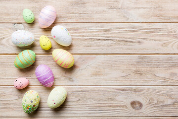 Fototapeta na wymiar decorative easter eggs on colored background. easter eggs collection top view with copy space