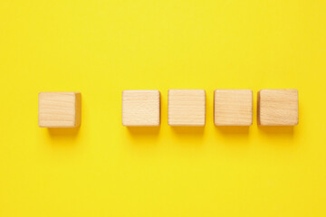 Blank wooden cubes for different concepts, top view