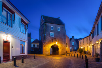 Fototapeta premium Architecture in the Woudrichem, Netherlands. Old historical buildings. Architectural landscape. Evening lighting in the city. Postcard view.