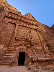 Entrance to a cave in the middle of the desert in Petra, Jordan