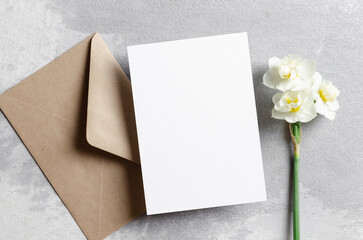 Wedding invitation card mockup with envelope and daffodils flowers