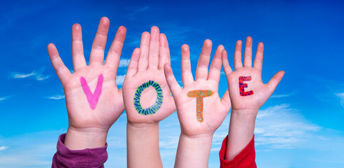 Children Hands Building Word Vote. Blue Sky
