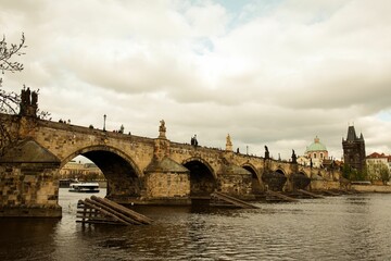 Scenic view of the mediaeval Charles bridge above the tranquil Vltava river in Prague, Czechia