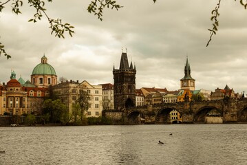 Fototapeta premium Charles Bridge crossing the Vltava River with the city in the background, Prague, Czech Republic