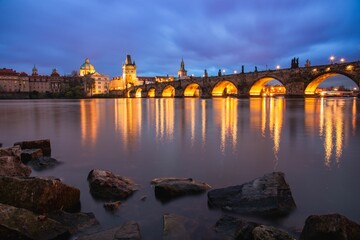 Charles Bridge crossing the Vltava River at night, Prague, Czech Republic