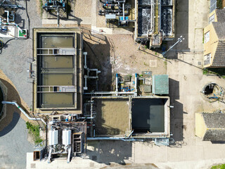 Drone top down view of the main stages of purification as seen in the dirt water tanks of a modern...